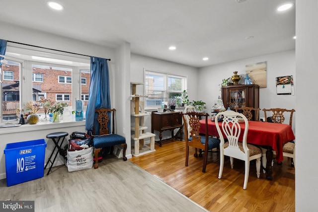 dining space with recessed lighting and wood finished floors