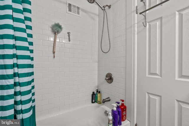 bathroom featuring visible vents and shower / bath combination with curtain