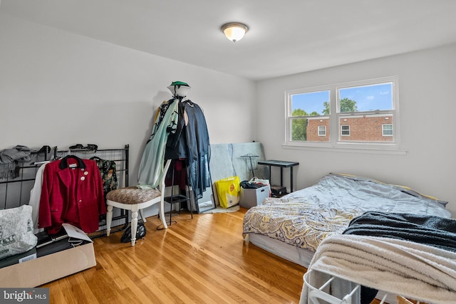 bedroom with wood finished floors