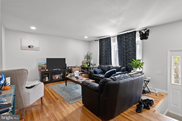 living area featuring recessed lighting and wood finished floors