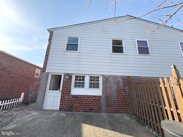 back of house with a patio area and fence