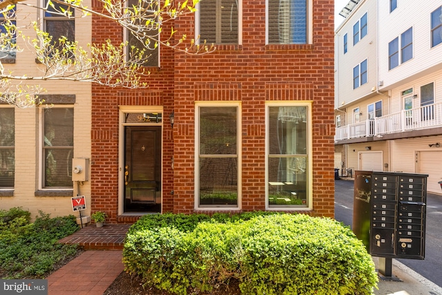 entrance to property with brick siding
