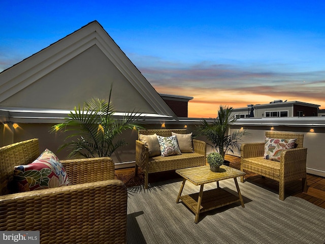 wooden deck with an outdoor living space and baseboard heating