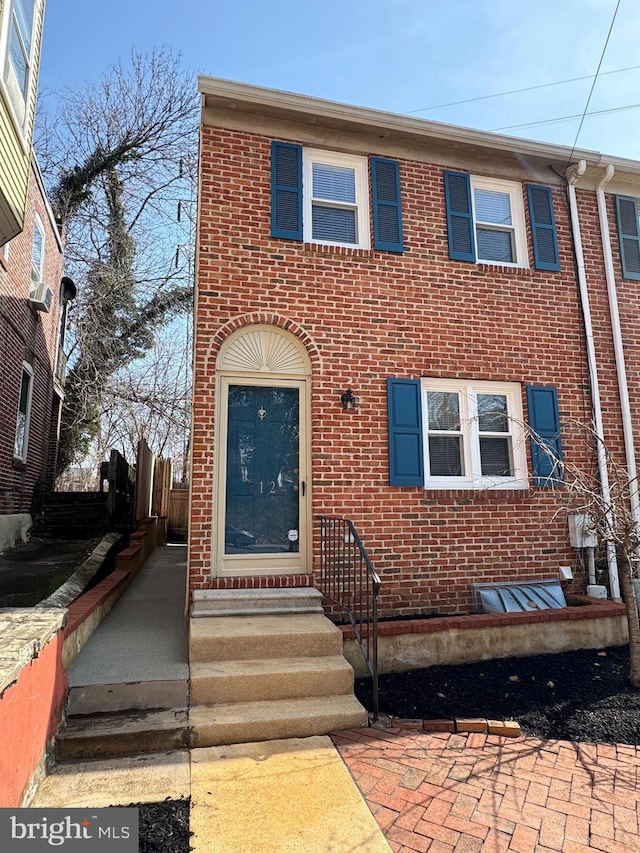 view of property with brick siding