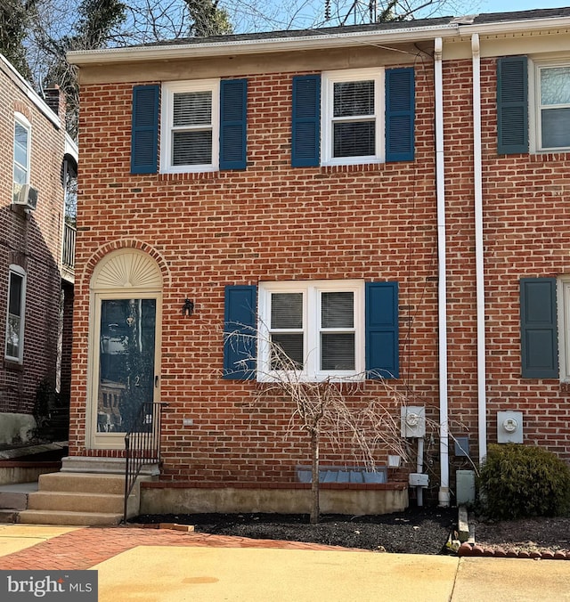 view of front of house with brick siding