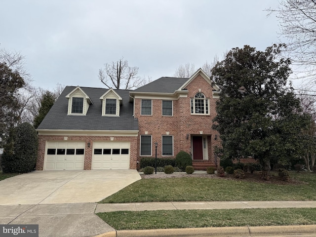 view of front of house featuring concrete driveway, brick siding, a garage, and a front yard