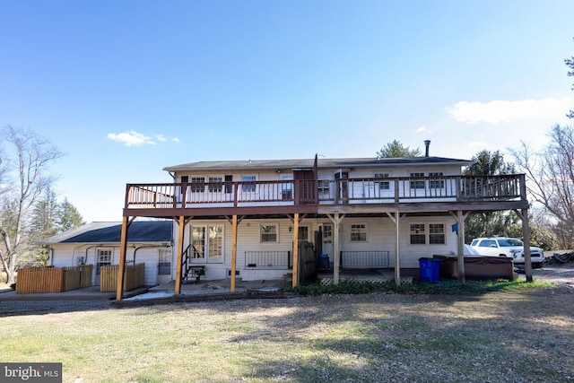 back of house with a patio area and a deck