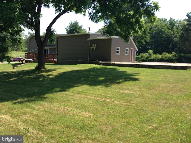 view of yard featuring a wooden deck