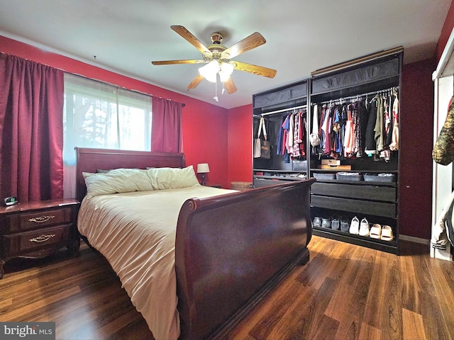 bedroom with a ceiling fan and wood finished floors