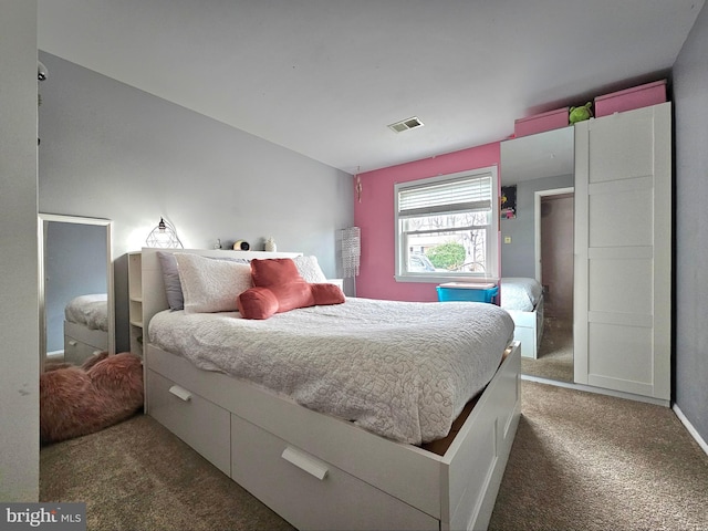 bedroom featuring visible vents and carpet flooring