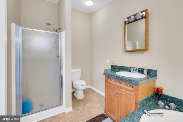 full bathroom featuring toilet, vanity, a shower stall, tile patterned flooring, and baseboards