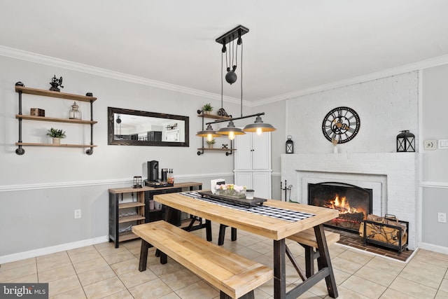 dining space with light tile patterned floors, a fireplace, and crown molding