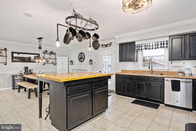 kitchen featuring a sink, wooden counters, dishwasher, and dark cabinets