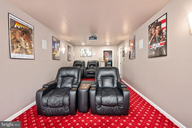 carpeted cinema featuring baseboards