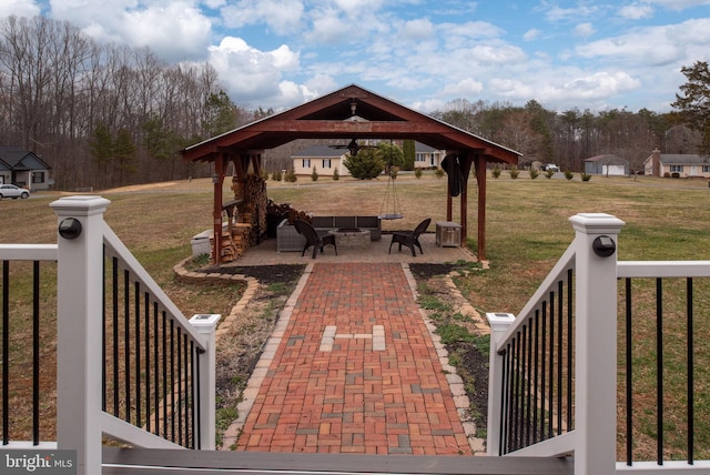 view of patio featuring a gazebo and an outdoor living space