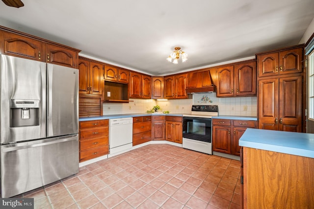 kitchen with premium range hood, electric stove, tasteful backsplash, white dishwasher, and stainless steel fridge with ice dispenser