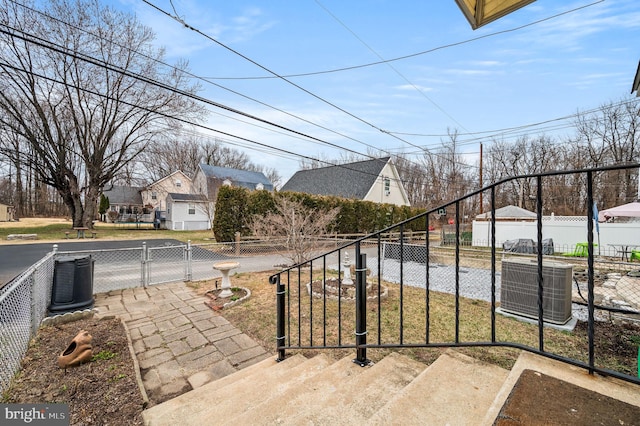 view of patio / terrace with fence private yard and central AC