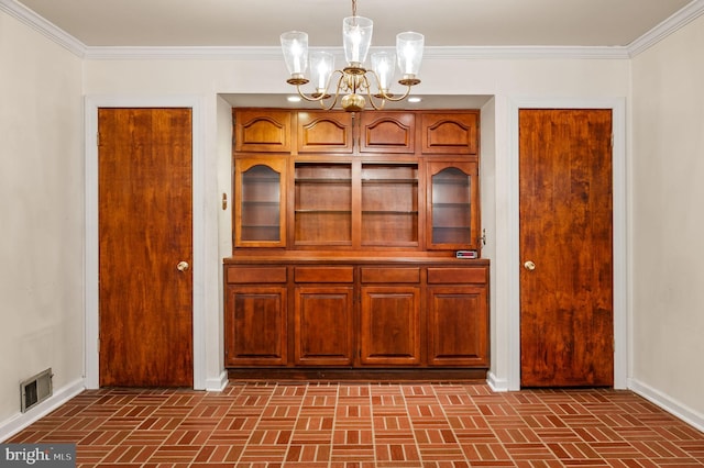 interior space with brick floor, visible vents, a notable chandelier, and crown molding