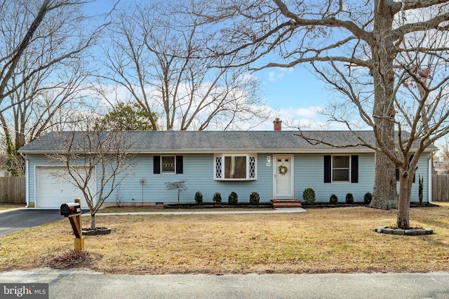 single story home featuring a front yard, fence, driveway, a chimney, and a garage