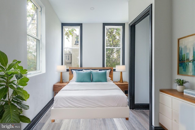 bedroom with light wood-style flooring