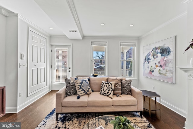 living area with visible vents, baseboards, dark wood finished floors, and ornamental molding