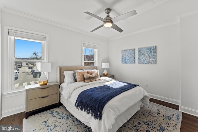 bedroom with baseboards, wood finished floors, and crown molding