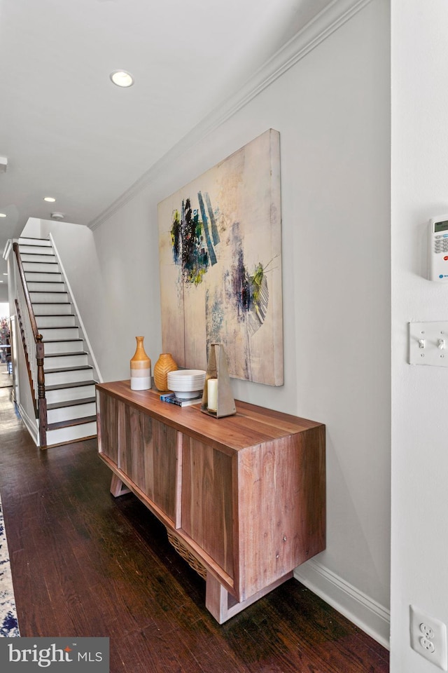 interior space with ornamental molding, hardwood / wood-style floors, recessed lighting, stairway, and baseboards