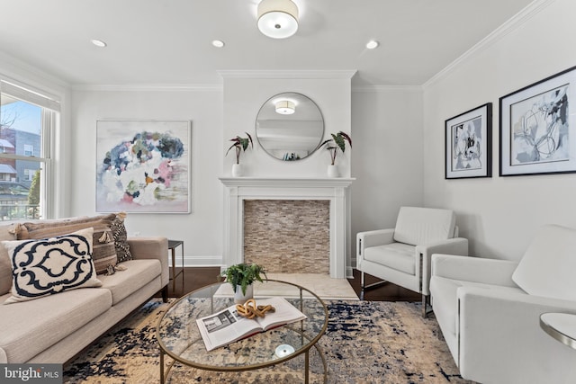 living room with crown molding, baseboards, a fireplace with flush hearth, recessed lighting, and wood finished floors