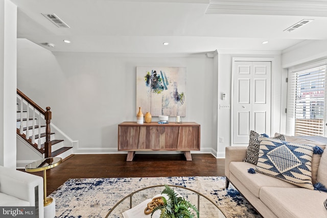 living room with recessed lighting, visible vents, baseboards, and wood finished floors