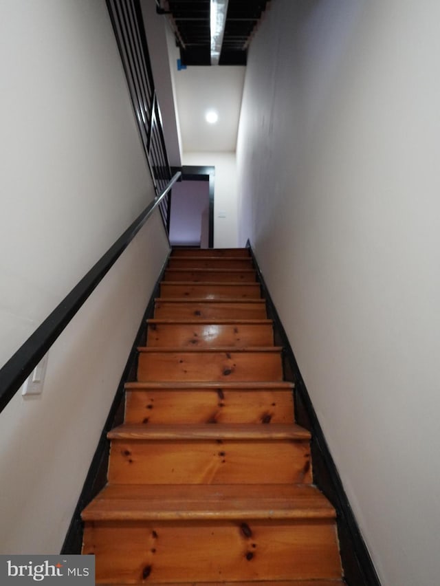 stairs featuring baseboards