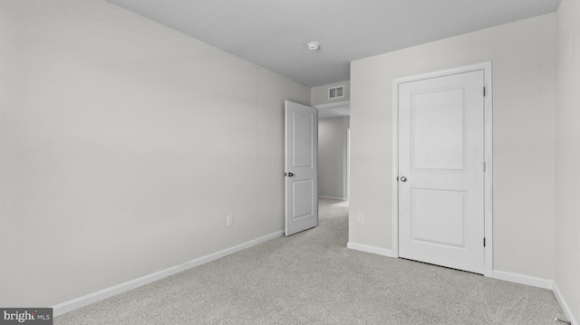 unfurnished bedroom with visible vents, baseboards, and carpet floors