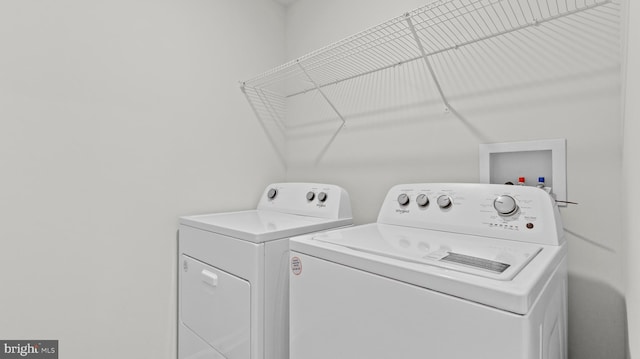 laundry area with laundry area and washing machine and clothes dryer