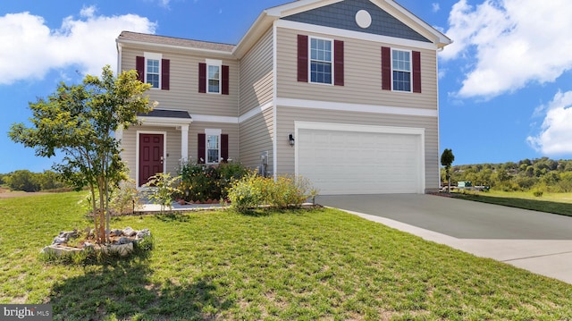 traditional-style home with concrete driveway, a garage, and a front yard