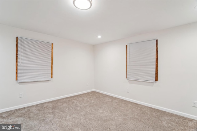 carpeted empty room with recessed lighting and baseboards