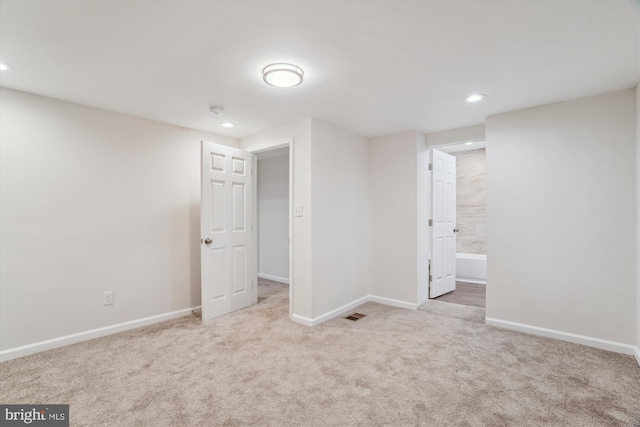 interior space with visible vents, recessed lighting, baseboards, and carpet floors