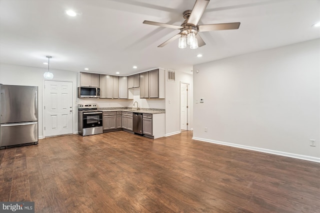 kitchen featuring recessed lighting, stainless steel appliances, visible vents, and dark wood-style floors