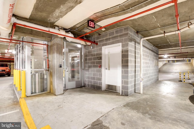 garage with concrete block wall