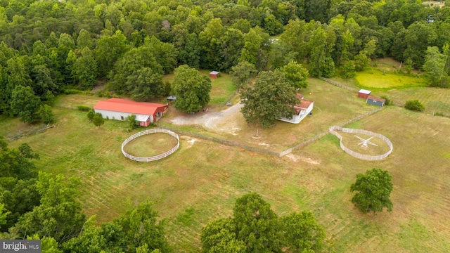 birds eye view of property with a forest view