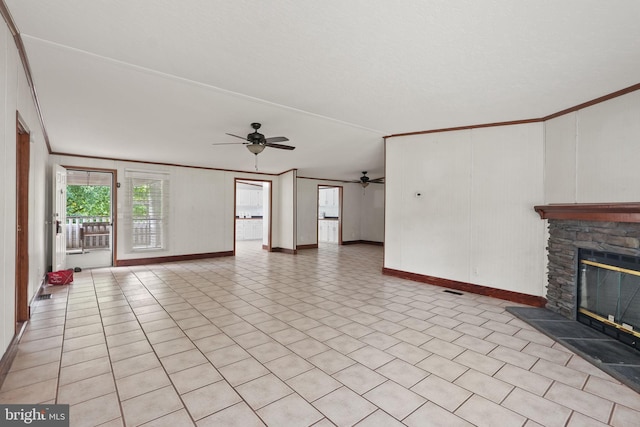 unfurnished living room featuring a fireplace, crown molding, a ceiling fan, and visible vents