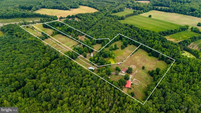 birds eye view of property with a rural view