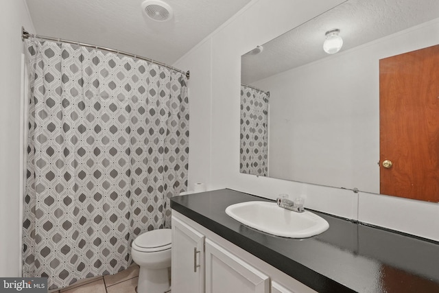 full bath with visible vents, toilet, a textured ceiling, tile patterned flooring, and vanity