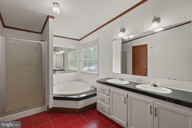 bathroom with a garden tub, ornamental molding, a stall shower, and a sink