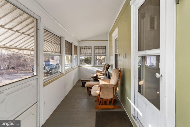 sunroom featuring lofted ceiling