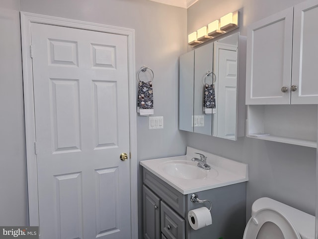 bathroom with vanity and toilet