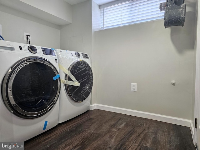 laundry area with washer and dryer, baseboards, dark wood finished floors, and laundry area