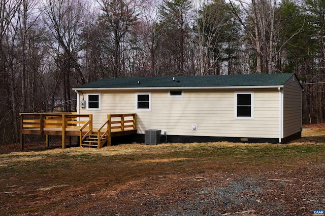 rear view of property with a deck, central AC, a shingled roof, and crawl space