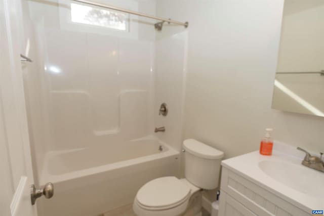 full bath featuring shower / bathtub combination, toilet, and vanity