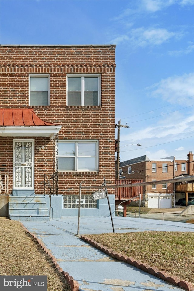 multi unit property featuring brick siding