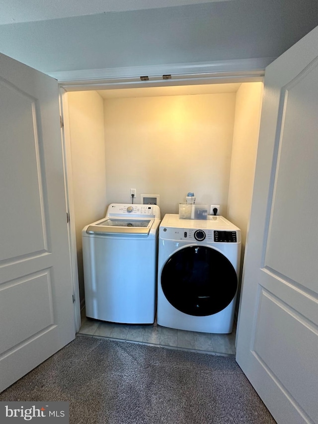 laundry room with washer and dryer, carpet, and laundry area