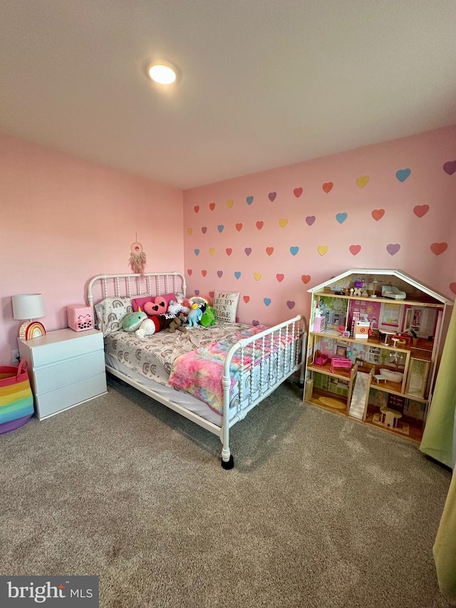 bedroom with carpet flooring and wallpapered walls